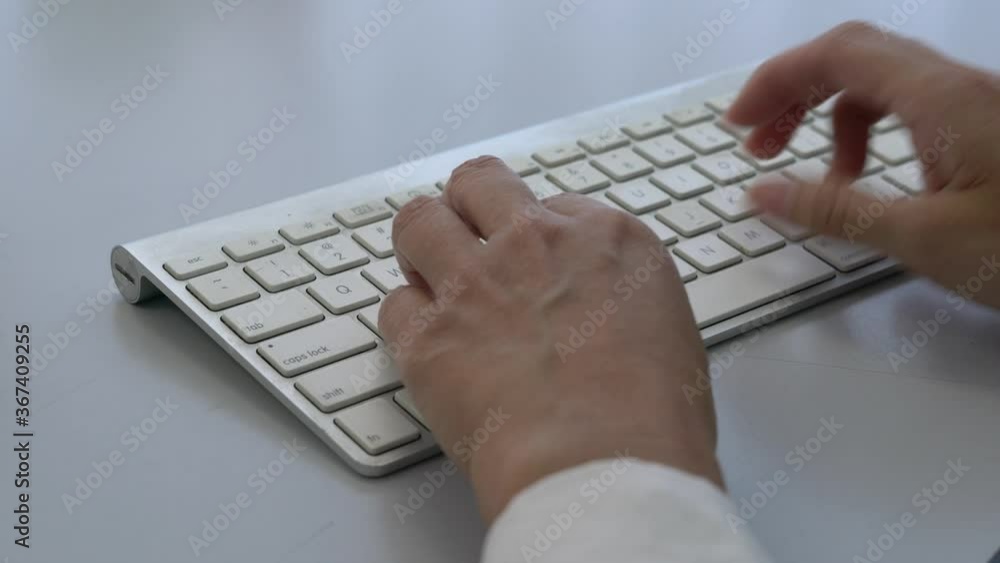 Businesswoman typing on the computer keyboard. Closeup. Businesswoman typing on the computer keyboard. Closeup.