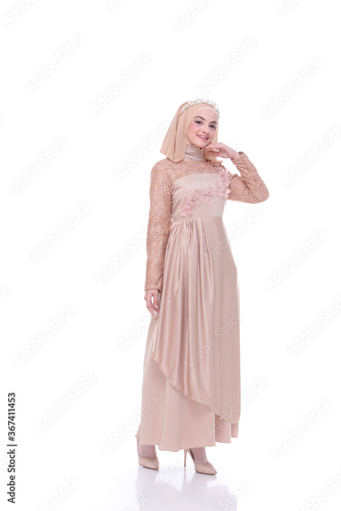 Beautiful islamic female model wearing hijab fashion, a modern lifestyle outfit for muslim woman. Concept a wedding dress, beauty or eidul fitri. A asian girl model wearing hijab on indoor photoshoot