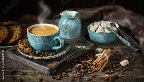 Blue coffee Cup on a wooden Board, coffee beans, sugar, flavor, chocolate cookies, vintage, retro, dark, craft