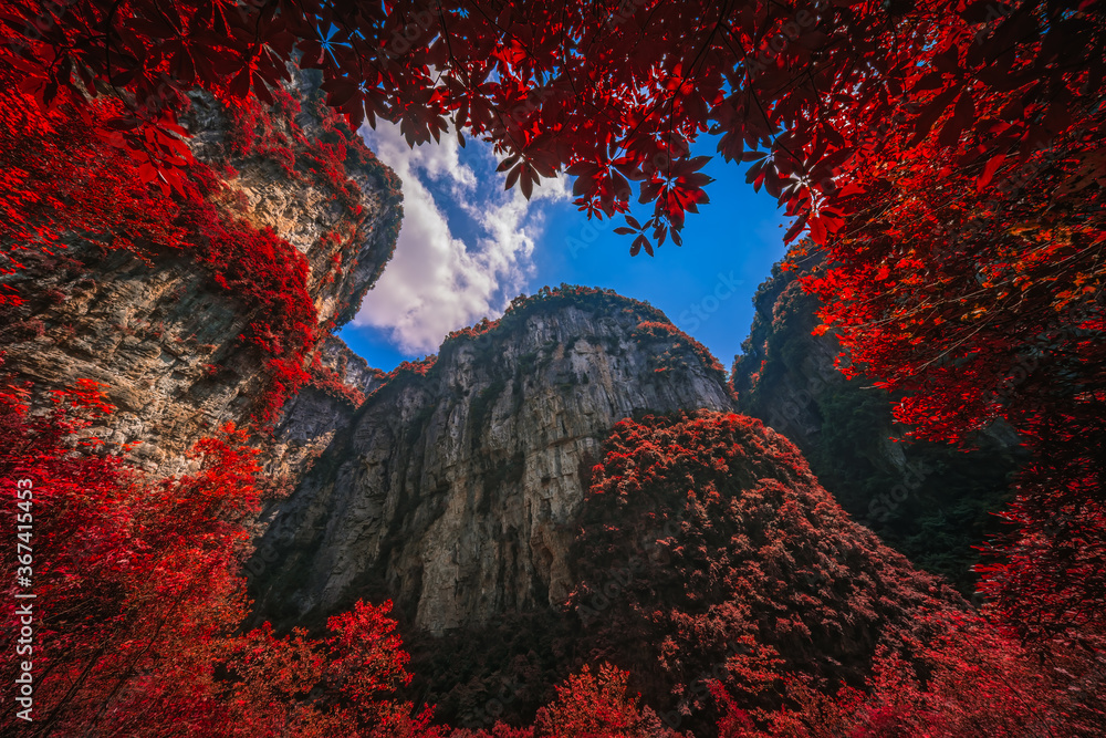 Massive vertical rock walls in Wulong National Park in autumn
