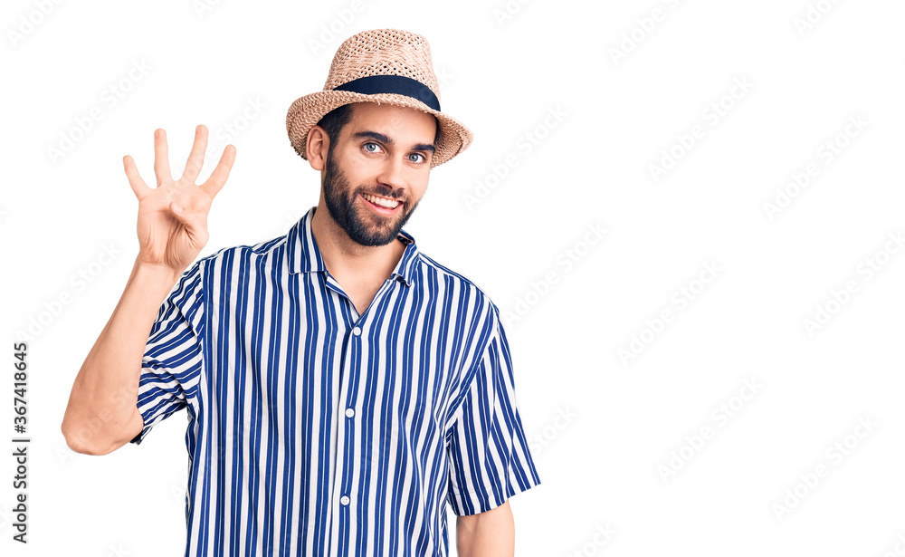 Young handsome man with beard wearing summer hat and striped shirt showing and pointing up with fingers number four while smiling confident and happy. Young handsome man with beard wearing summer hat and striped shirt showing and pointing up with fingers number four while smiling confident and happy.