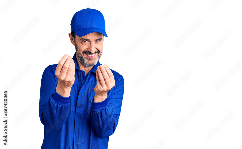 Middle age handsome man wearing mechanic uniform doing money gesture with hands, asking for salary payment, millionaire business Middle age handsome man wearing mechanic uniform doing money gesture with hands, asking for salary payment, millionaire business