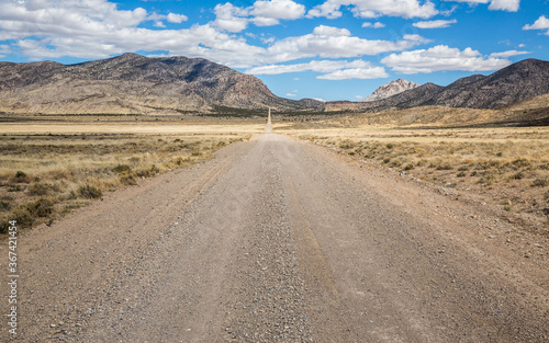 Dirt road through Utah desert toward Crystal Peak
