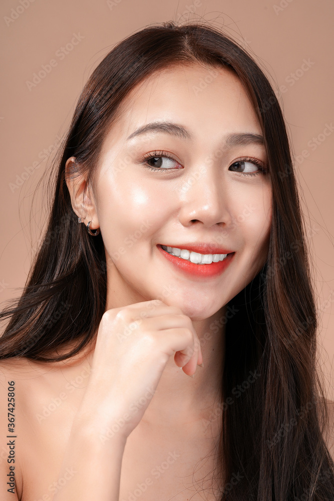 Face closeup of Asian beauty woman with natural makeup, cosmetic and plastic surgery concept, Isolated mocha brown background Face closeup of Asian beauty woman with natural makeup, cosmetic and plastic surgery concept, Isolated mocha brown background