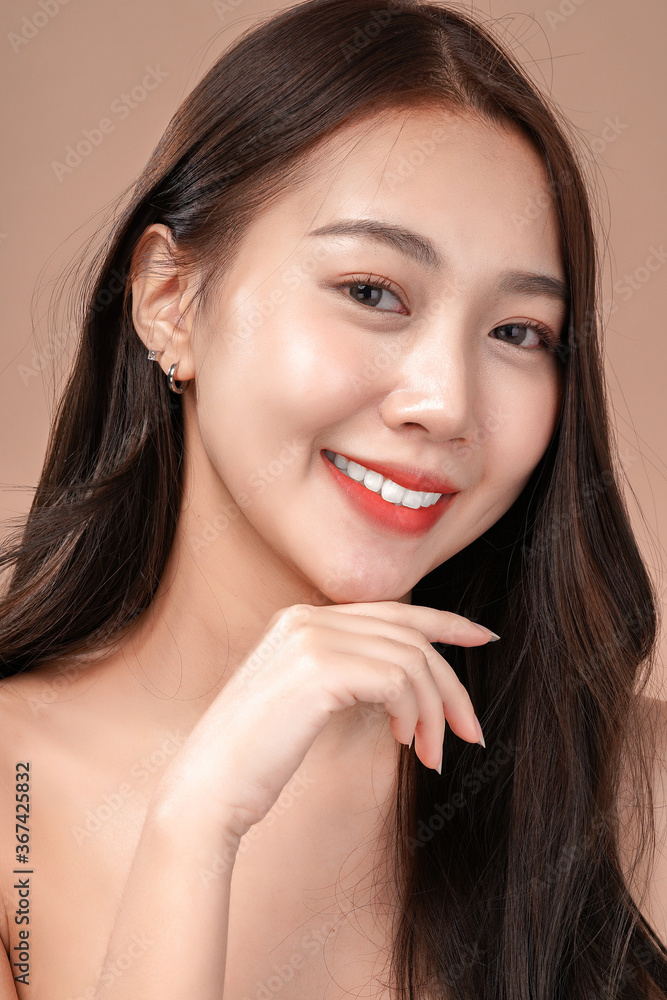 Face closeup of Asian beauty woman with natural makeup, cosmetic and plastic surgery concept, Isolated mocha brown background Face closeup of Asian beauty woman with natural makeup, cosmetic and plastic surgery concept, Isolated mocha brown background