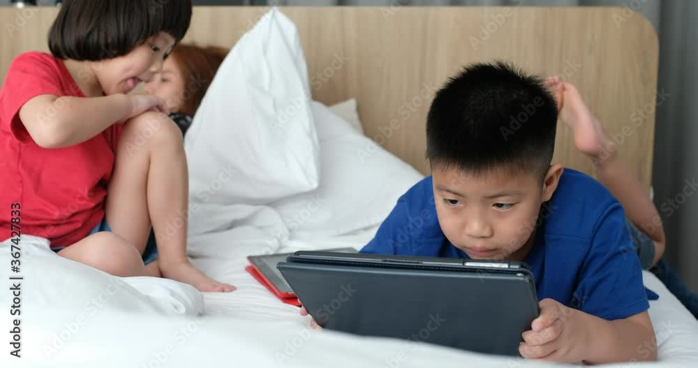 chinese child playing smartphone with mother, kid addicted tablet
chinese child playing smartphone with mother, kid addicted tablet