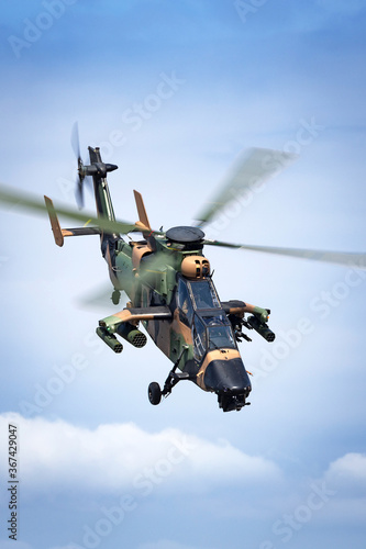 Camouflaged army attack helicopter.