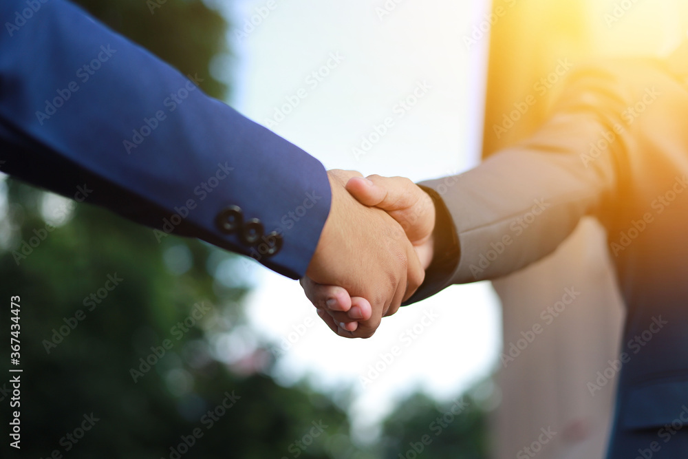 Business people shake hands Is a business etiquette to congratulate the combined work of the organization