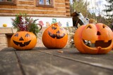 Three beautiful Halloween pumpkins on the table, each different, greeting customers