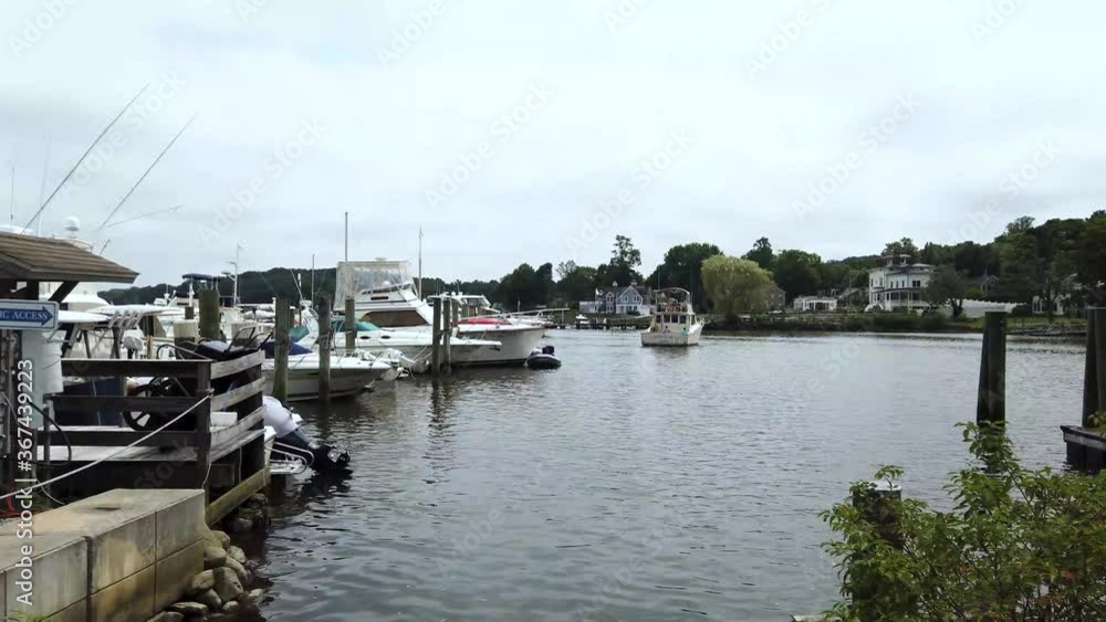Boat leaving Connecticut dock in Essex. Boat leaving Connecticut dock in Essex.