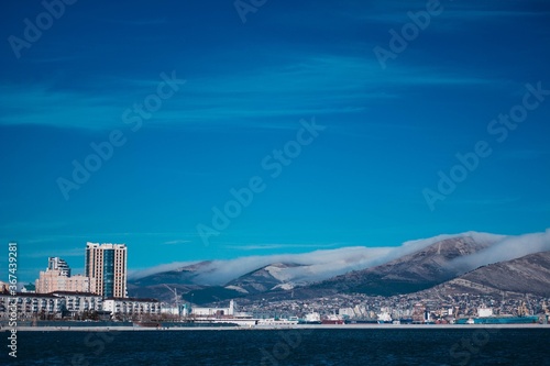 winter city on the background of snow-capped mountains