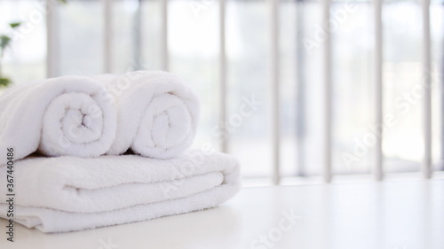 white towel on a white towel,Spa accessories,Beautiful composition of spa , spa relax concept,  herbs for massage, beautiful spa set on wood table,For marketing products