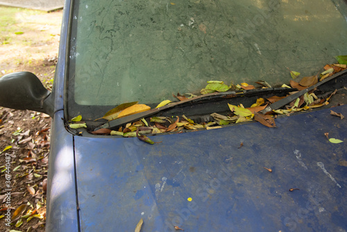 Abandoned car with windshield and wiper whose tyre, wheel stuck in mud. car that was submerged in food water Kerala, India.