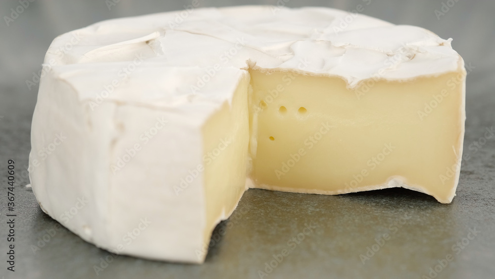 Camembert cheese close up. Rotation pieces of soft cheese Camembert