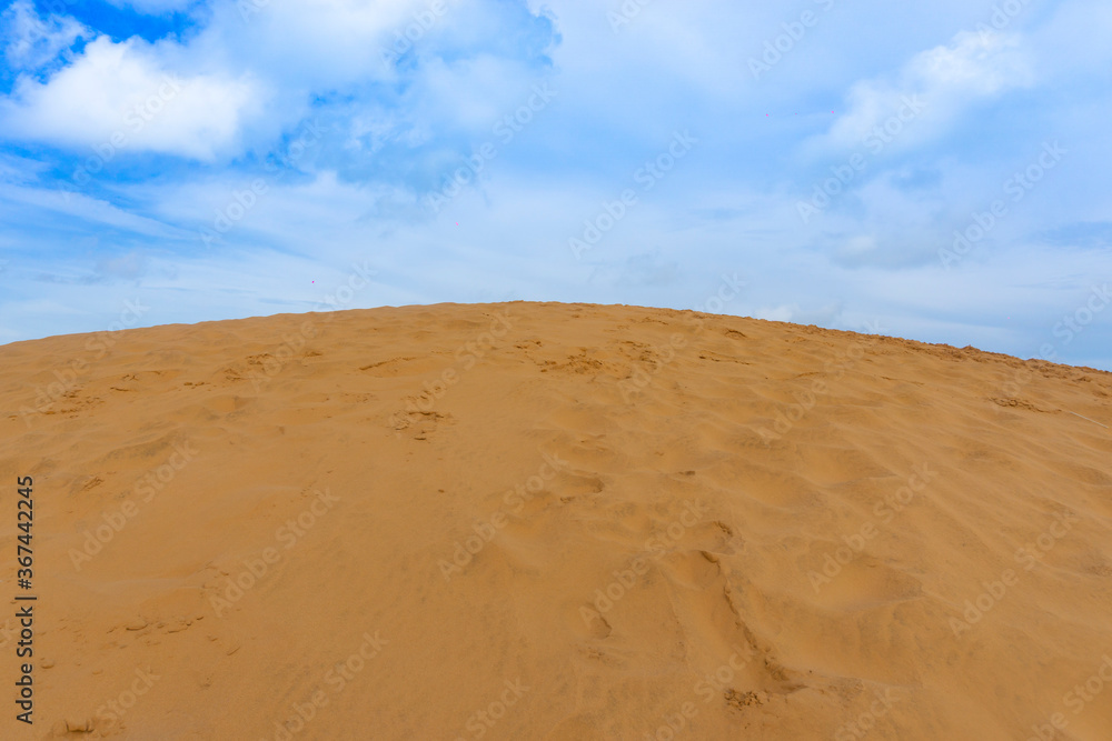 Naklejka premium Red Sand Dunes, also known as Golden Sand Dunes, is located near Hon Rom beach, Mui Ne, Phan Thiet city.