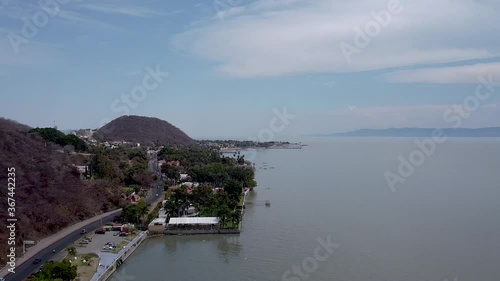 Aerial drone footage of a lakeside road along Lake Chapala, Mexicos largest freshwater lake photo