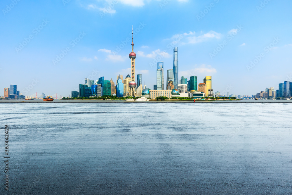 Empty asphalt road and city skyline with buildings in Shanghai,China.