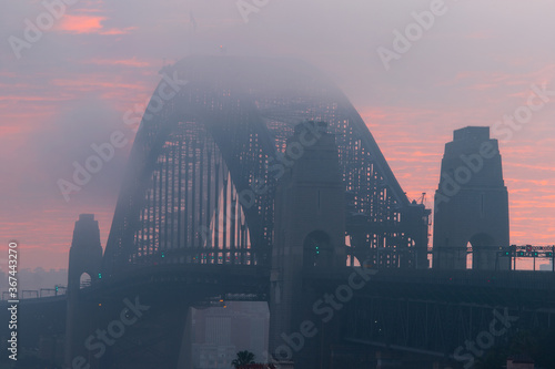 Close-up view of fog covering Sydney Harbour Bridge.