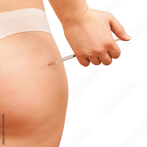 female butt injection. Self ass syringe. Taking body injecting. Woman insulin shot. Home medical treatment photo