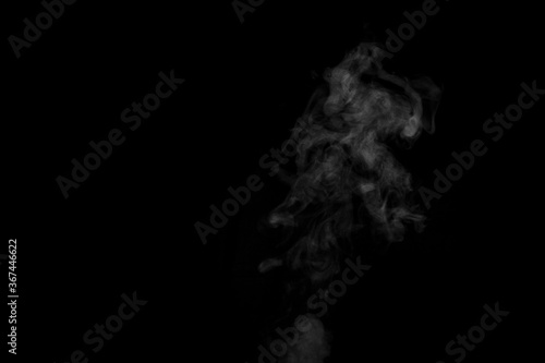 White smoke isolated on black background. smoke stock image