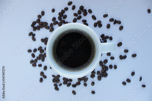 mug of coffee. the shadow from the coffee bean