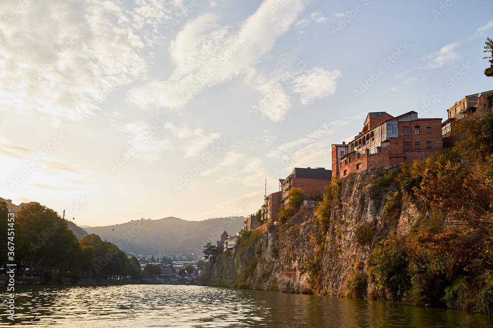 Tbilisi, Georgia - October 21, 2019: River Kura in capital of Georgia Tbilisi in a daytime and sightseeing from the water