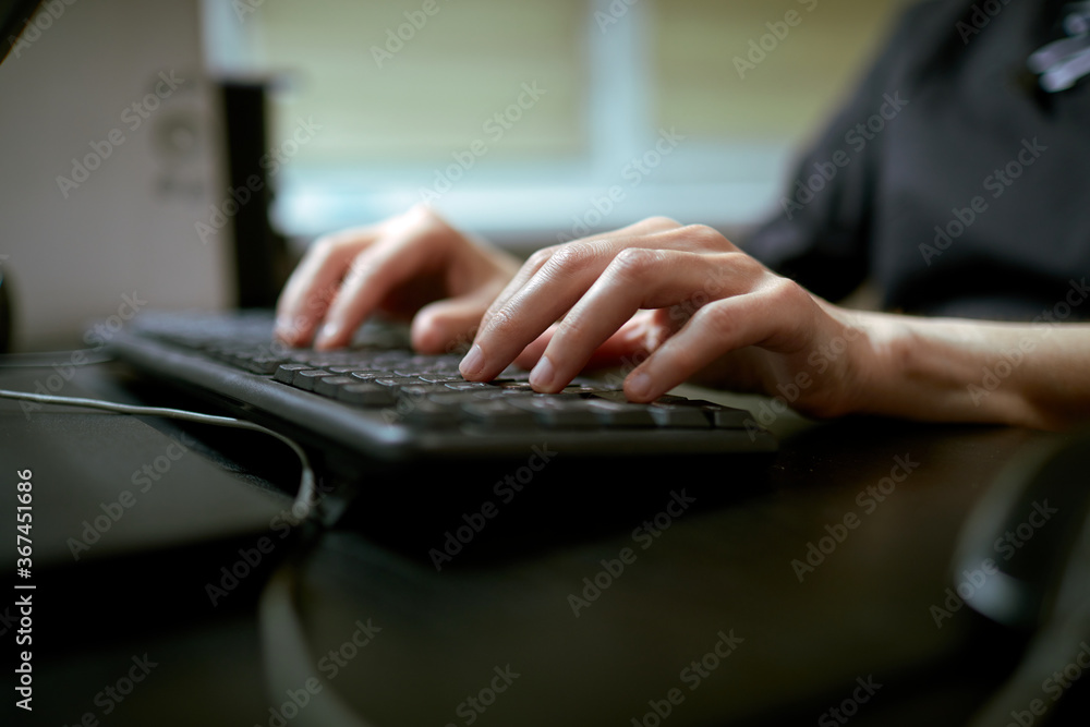 Female hands or woman office worker typing on the keyboard Female hands or woman office worker typing on the keyboard
