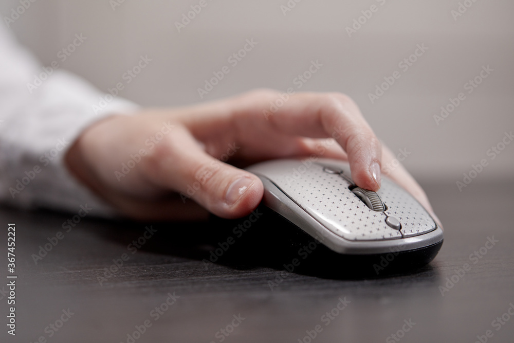 close up of businesswoman using computer mouse close up of businesswoman using computer mouse