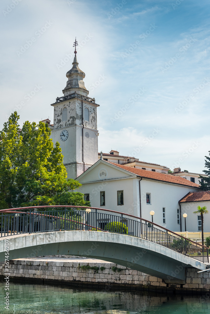 The bridge Ponte Della Madonnina over river with the church in the background in Crikvenica. Crikvenica is a popular holiday resort in Kvarner riviera in Croatia