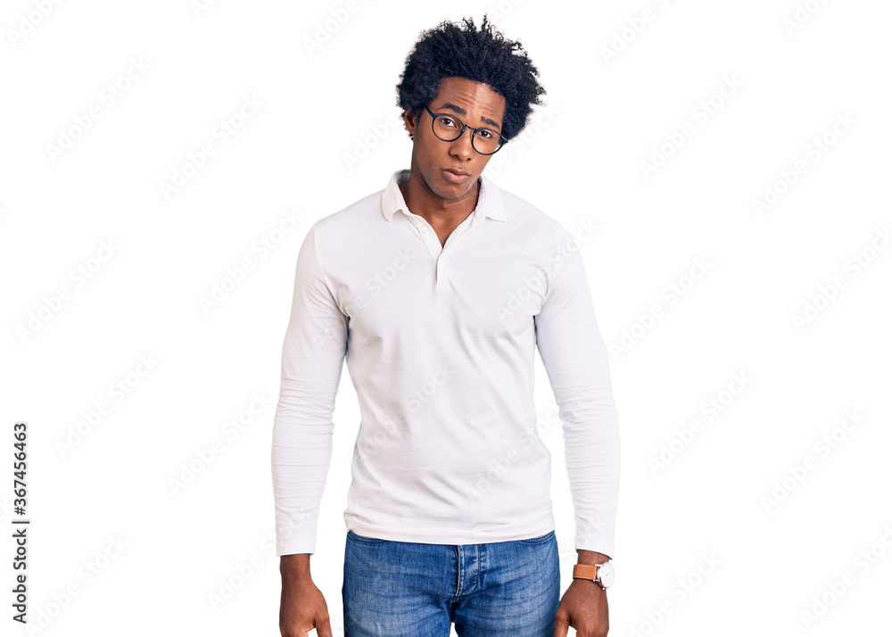Handsome african american man with afro hair wearing casual clothes and glasses skeptic and nervous, frowning upset because of problem. negative person. Handsome african american man with afro hair wearing casual clothes and glasses skeptic and nervous, frowning upset because of problem. negative person.