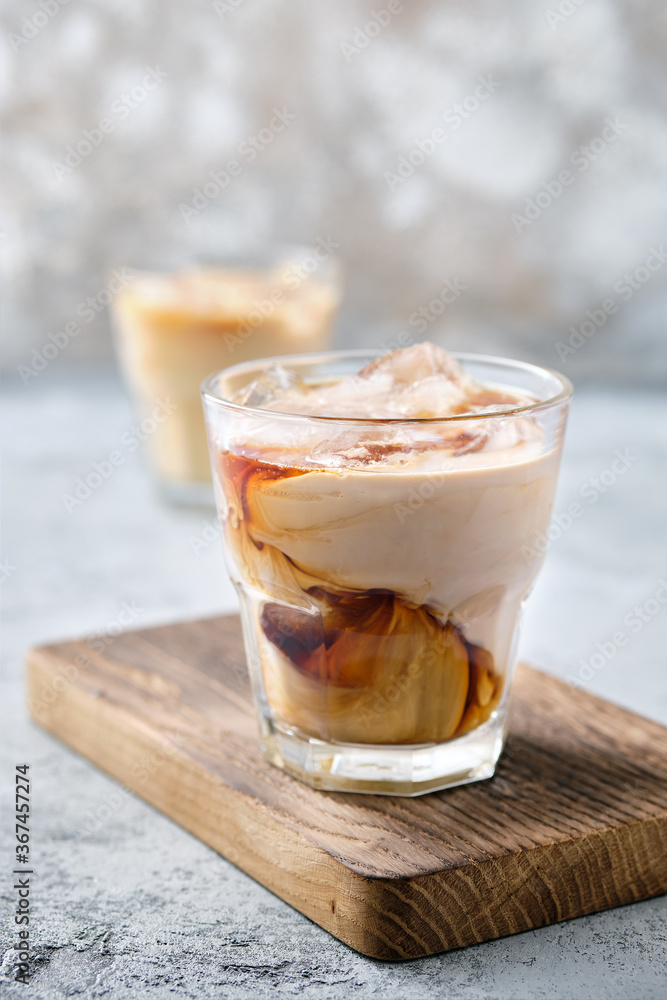 Iced coffee with fat cream in rocks glass Iced coffee with fat cream in rocks glass