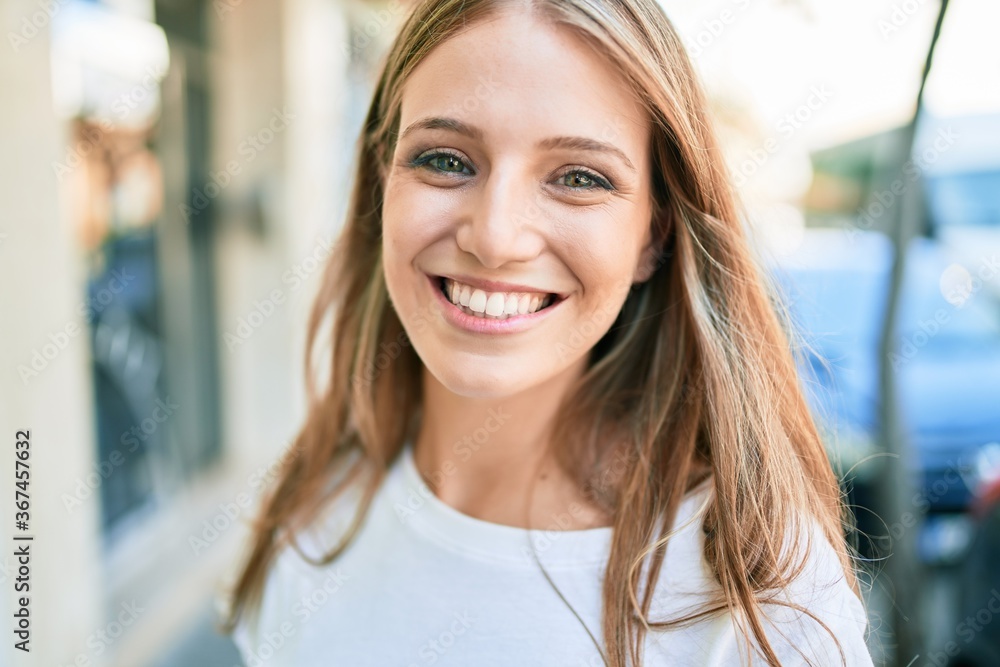 Young caucasian woman smiling happy walking at the city Young caucasian woman smiling happy walking at the city