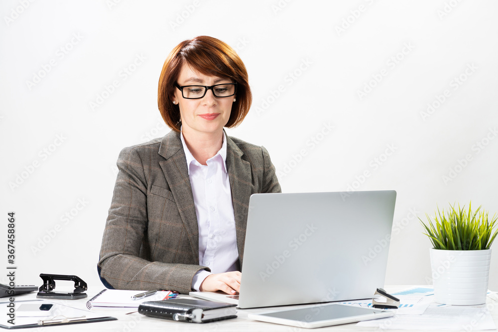 Attractive middle aged businesswoman working Attractive middle aged businesswoman working