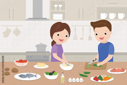 Happy love couple is cooking in the kitchen. Cooking Healthy food from different ingredients