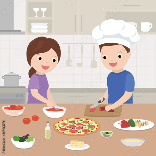 Happy love couple is cooking pizza in the kitchen. Kitchen interior with furniture on background.