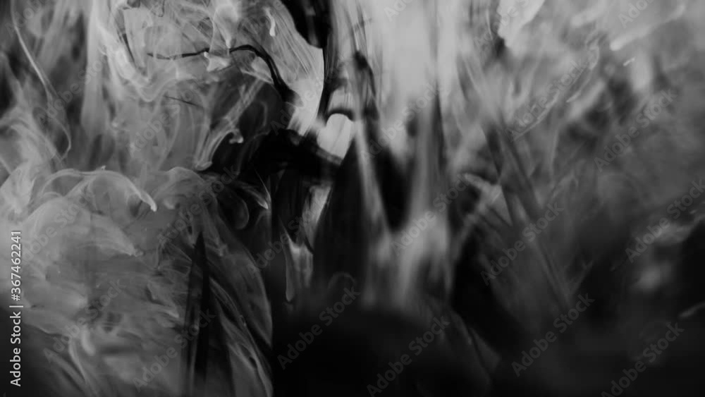 dark dramatic background with slow motion white liquid substance dark dramatic background with slow motion white liquid substance