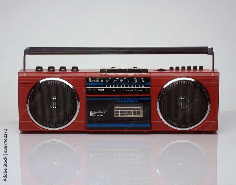 Fototapeta premium Vintage red boom box on white background with reflection