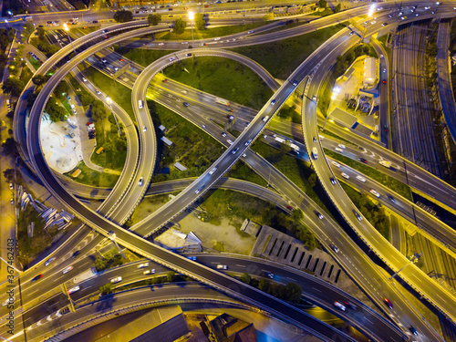 View from drone of highway and overpass in modern city at night