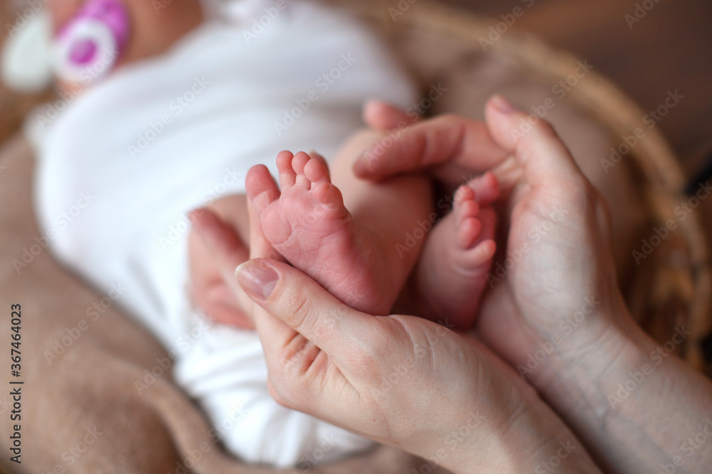 Newborn baby feet in father hands. Family concept. Props for little baby photoshoot. Newborn baby feet in father hands. Family concept. Props for little baby photoshoot.