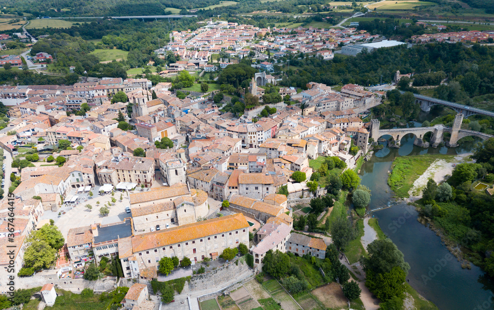 View from drone of medieval Spain town of Besalu with Romanesque bridge over Fluvia river