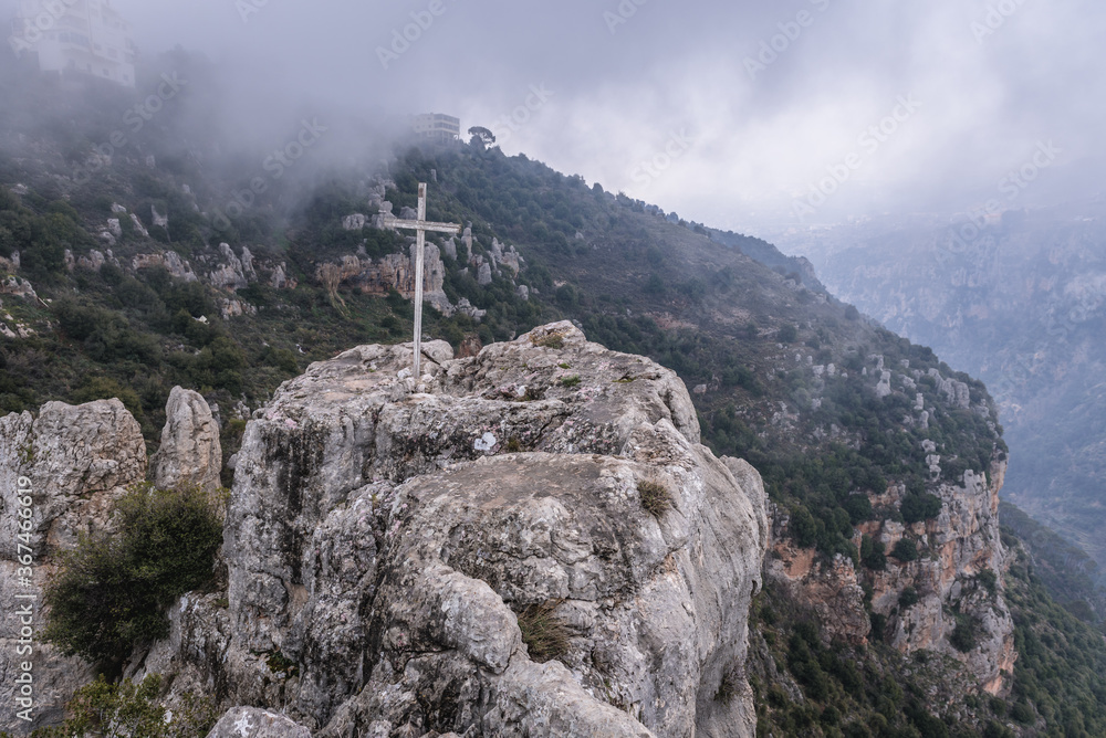 Fototapeta premium Cross above Kadisha Valley also spelled as Qadisha in Lebanon seen from Blouza village