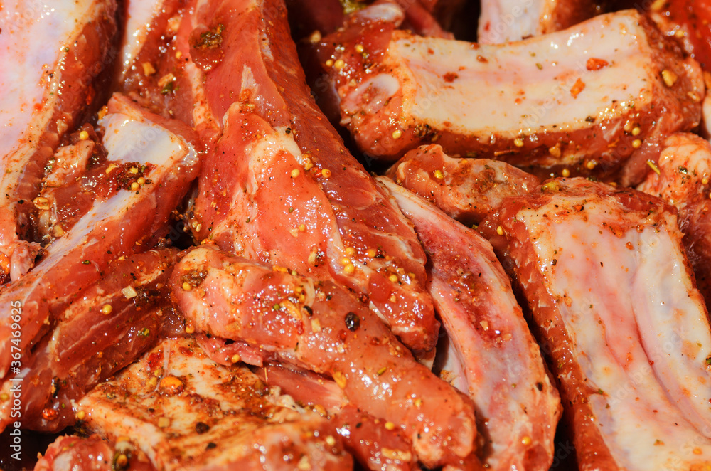 Tender meat on ribs is marinated and seasoned with barbecue seasonings. Tender meat on ribs is marinated and seasoned with barbecue seasonings.