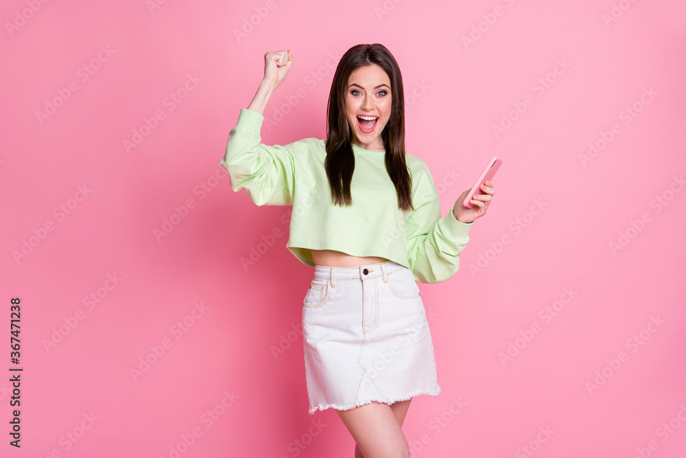 Photo of charming excited lady hold telephone read good news blog new followers subscribers popularity wear casual green crop pullover jeans skirt isolated pink pastel color background Photo of charming excited lady hold telephone read good news blog new followers subscribers popularity wear casual green crop pullover jeans skirt isolated pink pastel color background