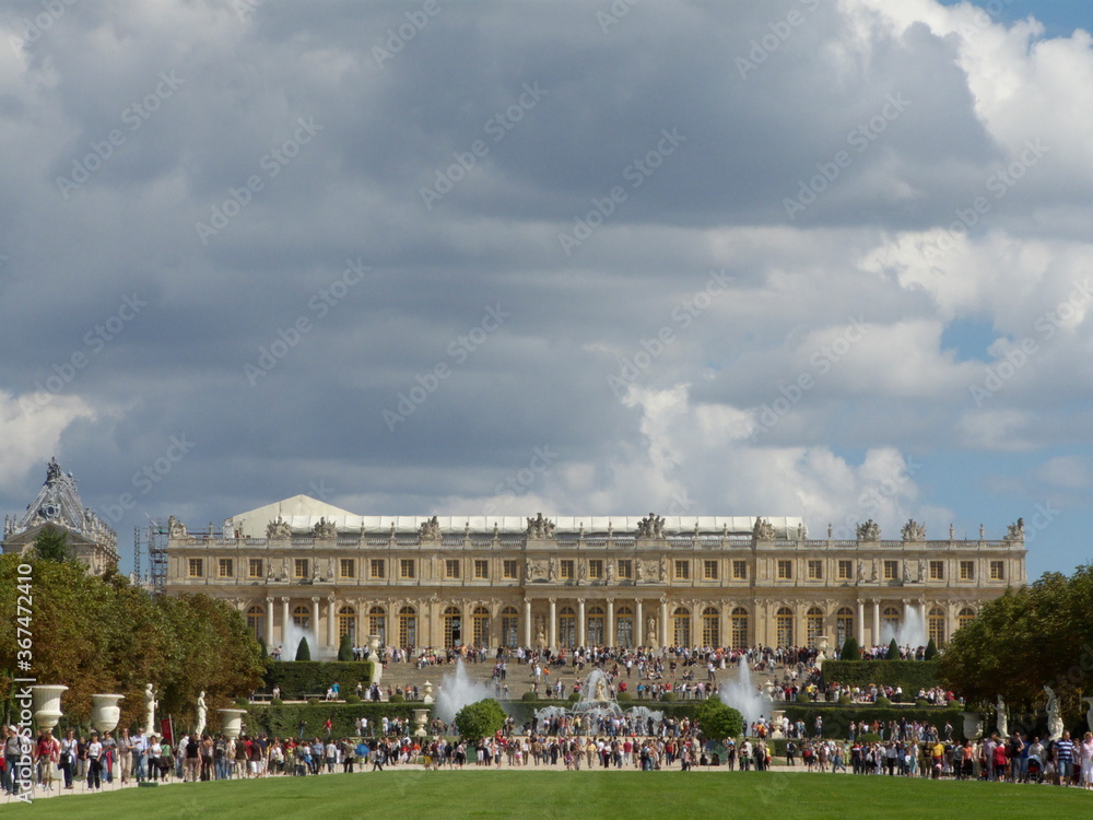 Versailles, France, the palace of Versailles with a beautiful garden in front of facade with a lot of fountains and statues