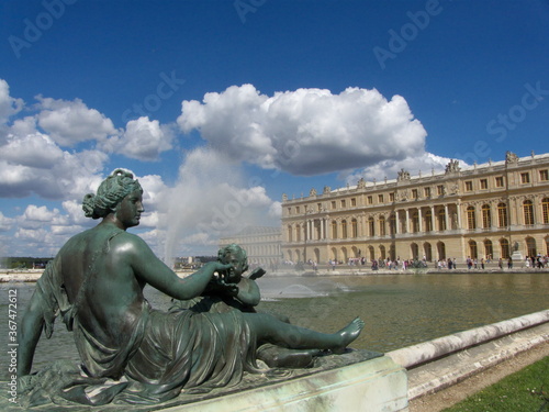 Versailles, France, the palace of Versailles with a beautiful garden in front of facade with a lot of fountains and statues