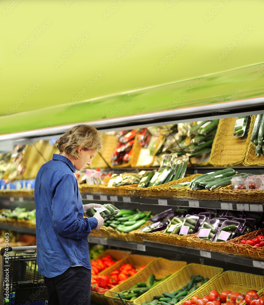 Supermarket shopping,  gloves,man buying vegetables at the market	