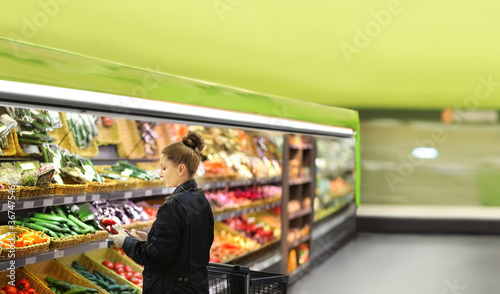 Supermarket shopping,  gloves,woman buying vegetables at the market	