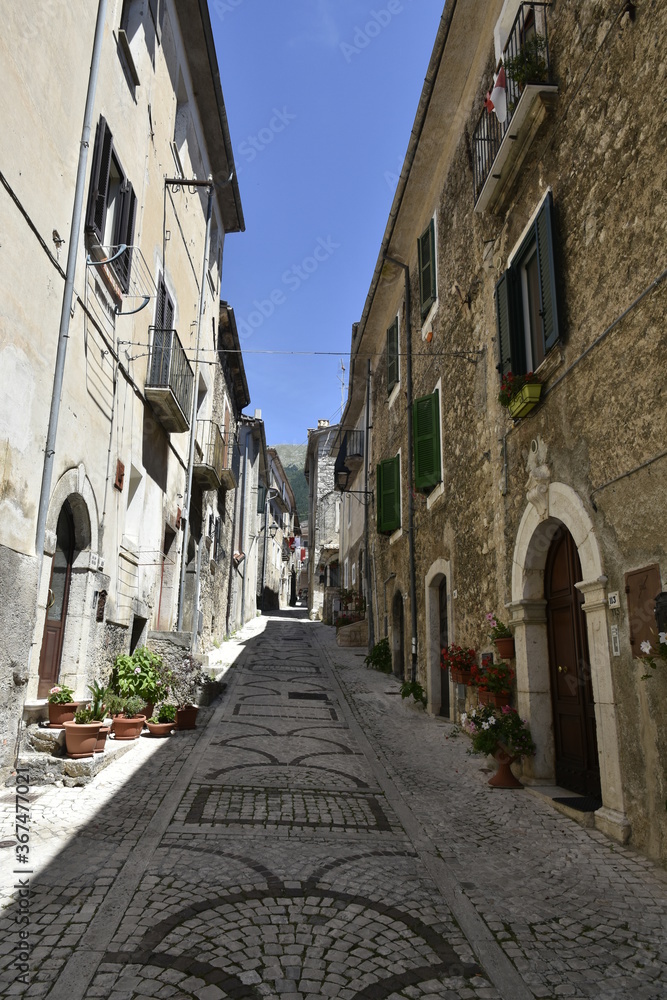 A narrow street in the old buildings of San Donato Val di Comino, a medieval village in the Lazio region.
