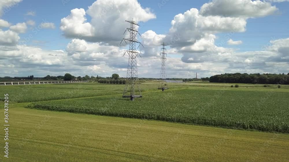Bridge over floodplains at IJssel river in Holland next to high voltage power piles Bridge over floodplains at IJssel river in Holland next to high voltage power piles