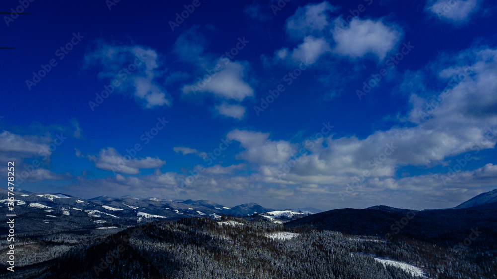 Carpathian mountains mountain range pine forests coniferous mountain tops winter snow aerial photography